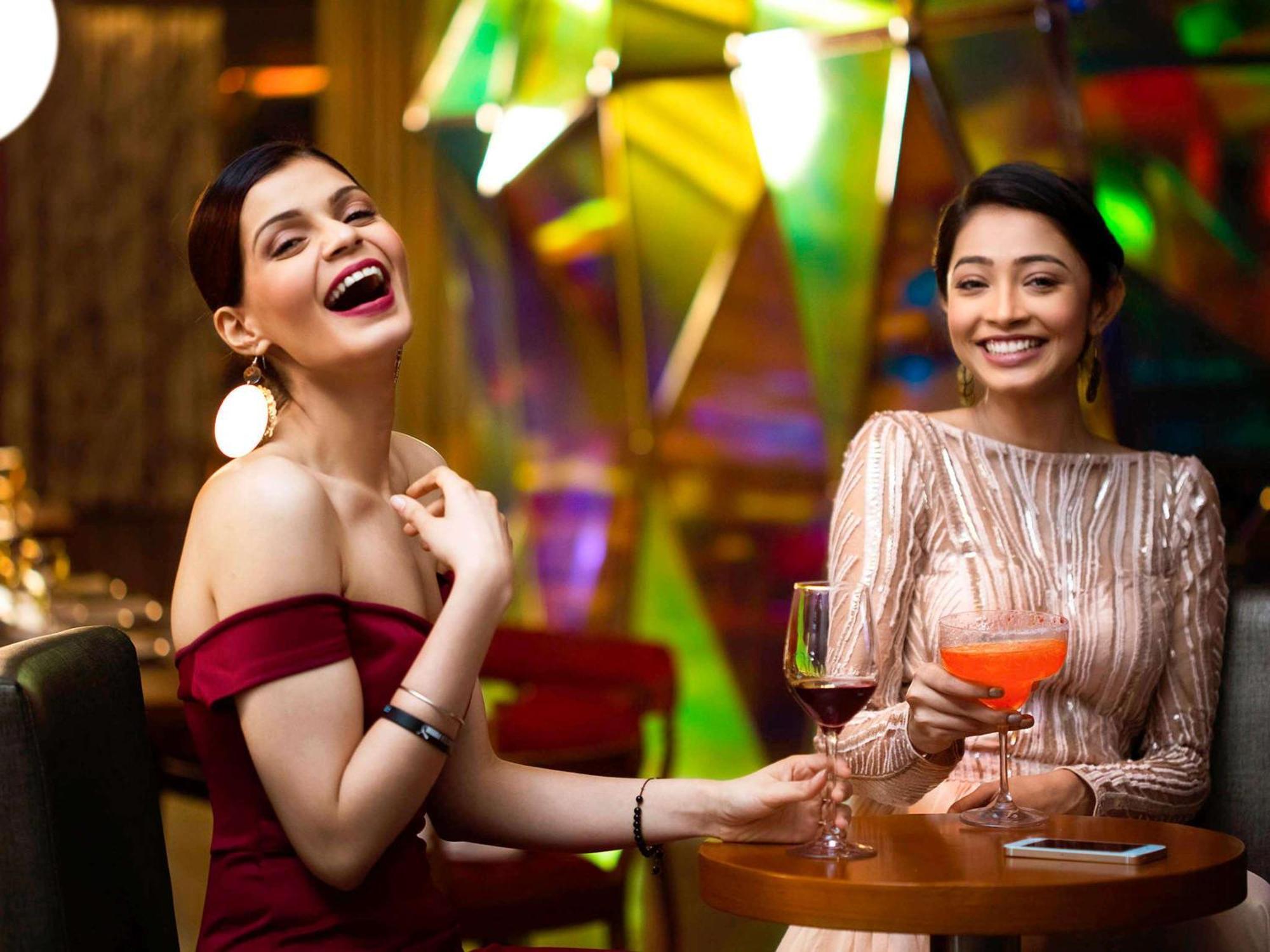 Novotel Kolkata Hotel And Residences Dış mekan fotoğraf Two women socializing